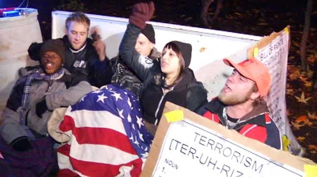 Occupy Portland protesters remain locked to barrier in park - KPTV ...